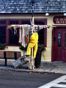 A fun fisherman scarecrow in front of Quarterdeck restaurant